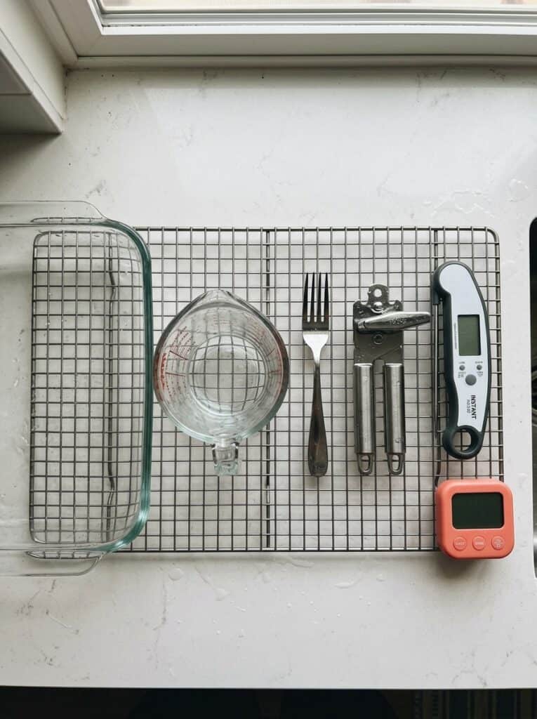 Five things to wash after a tuna noodle casserole: glass dish, measuring cup, fork, can opener, thermometer